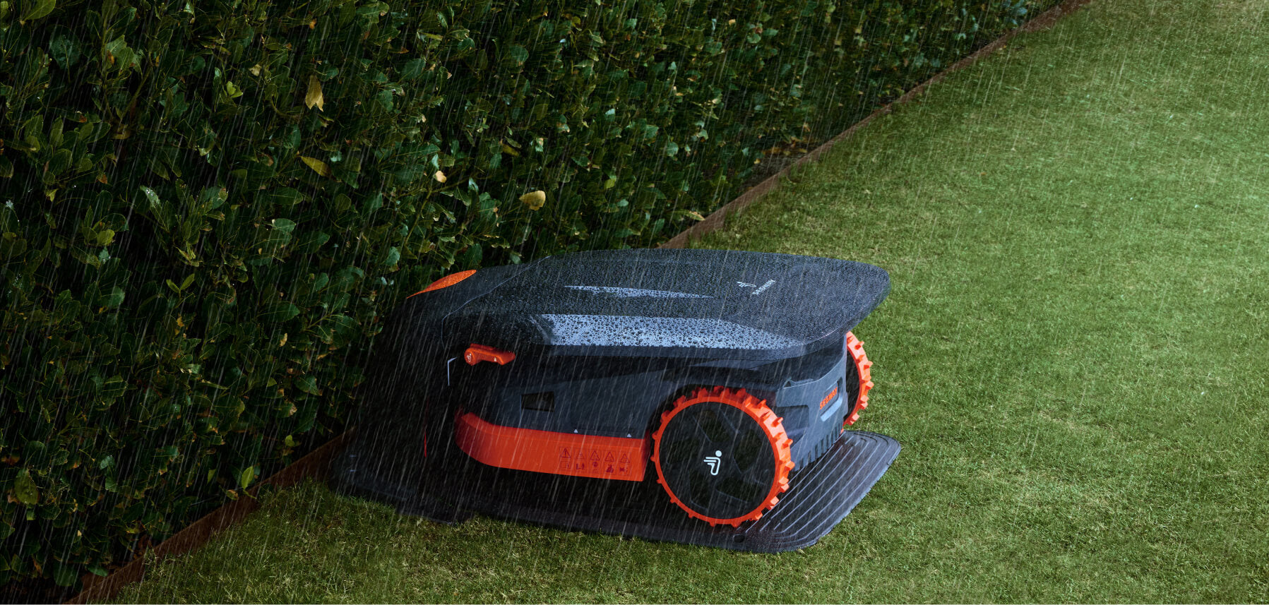 Segway Navimow robot lawn mower is parked in the rain.