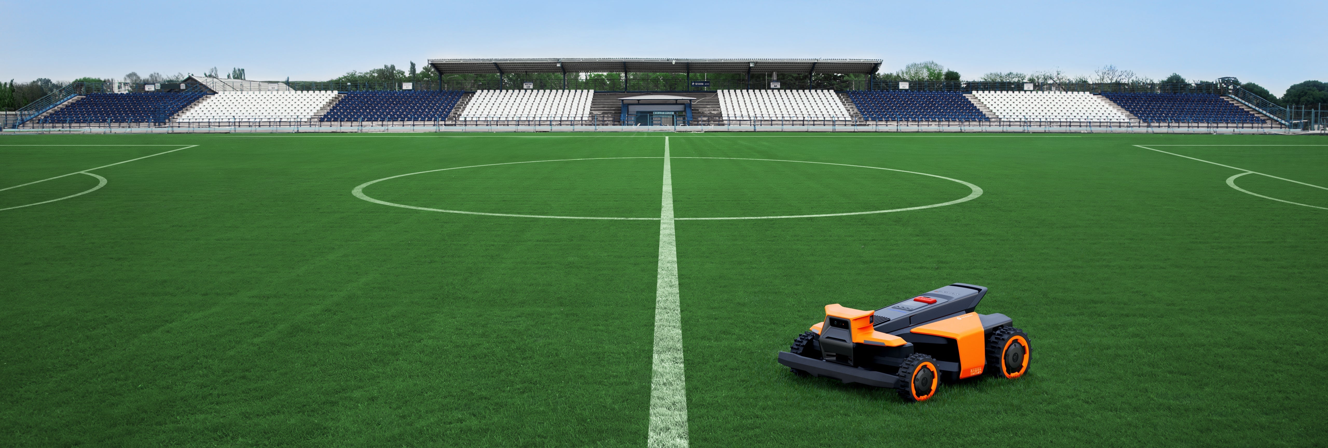 Segway Navimow i110E robot lawn mower on a soccer field.