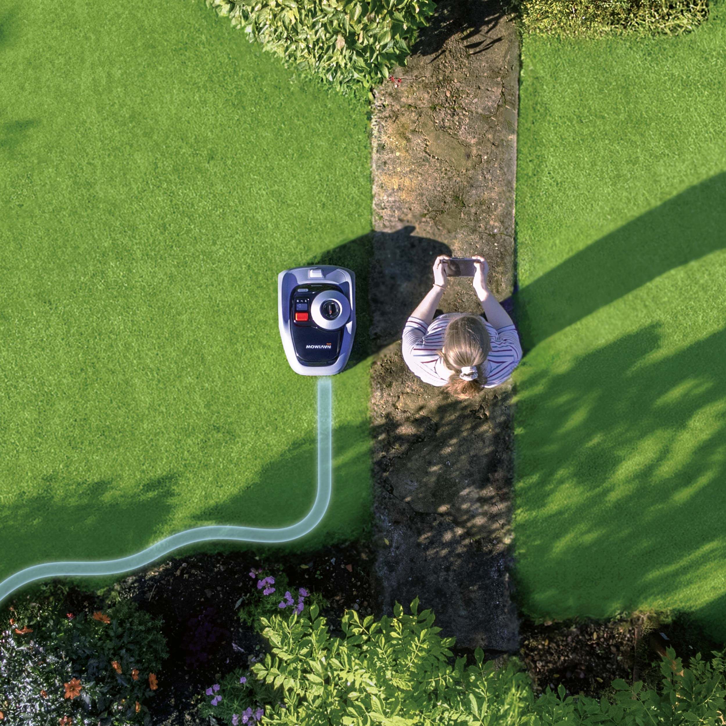 Navimow i110 robot lawn mower being mapped by a user.