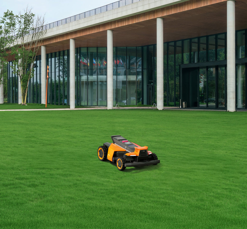 Navimow i110N robot lawn mower is on a green field.