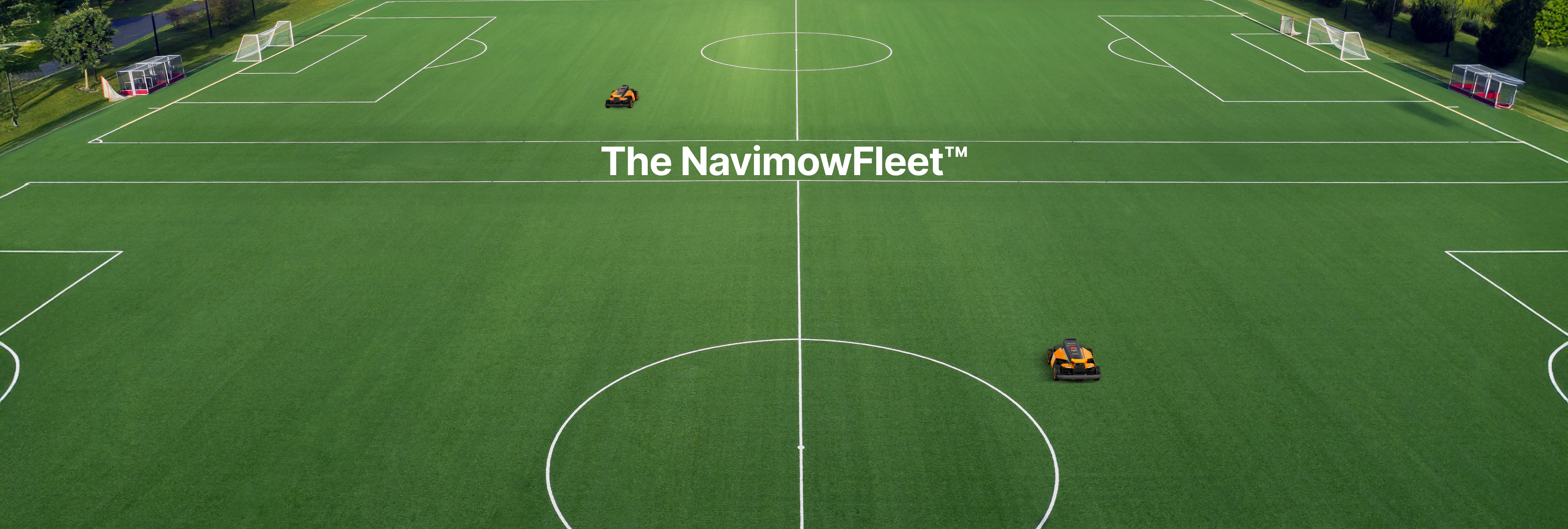 Segway Navimow NavimowFleet robot lawn mower working on soccer field.