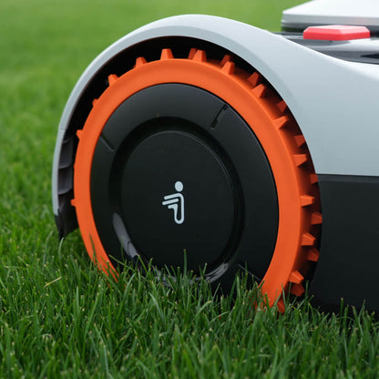 Segway Navimow i110E robot lawn mower sits on the grass.