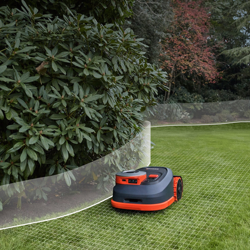 The Navimow i110E robot lawn mower mows a green lawn.