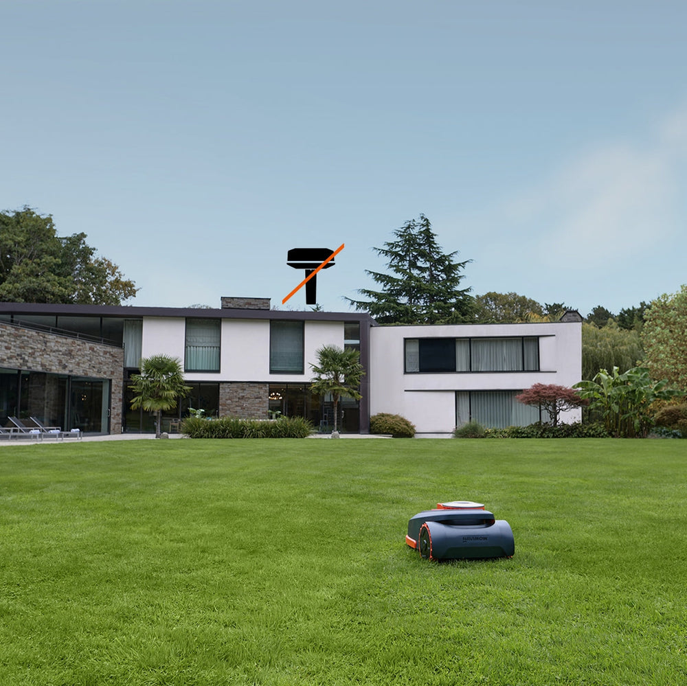 Navimow i110E robot lawn mower on a large green lawn.
