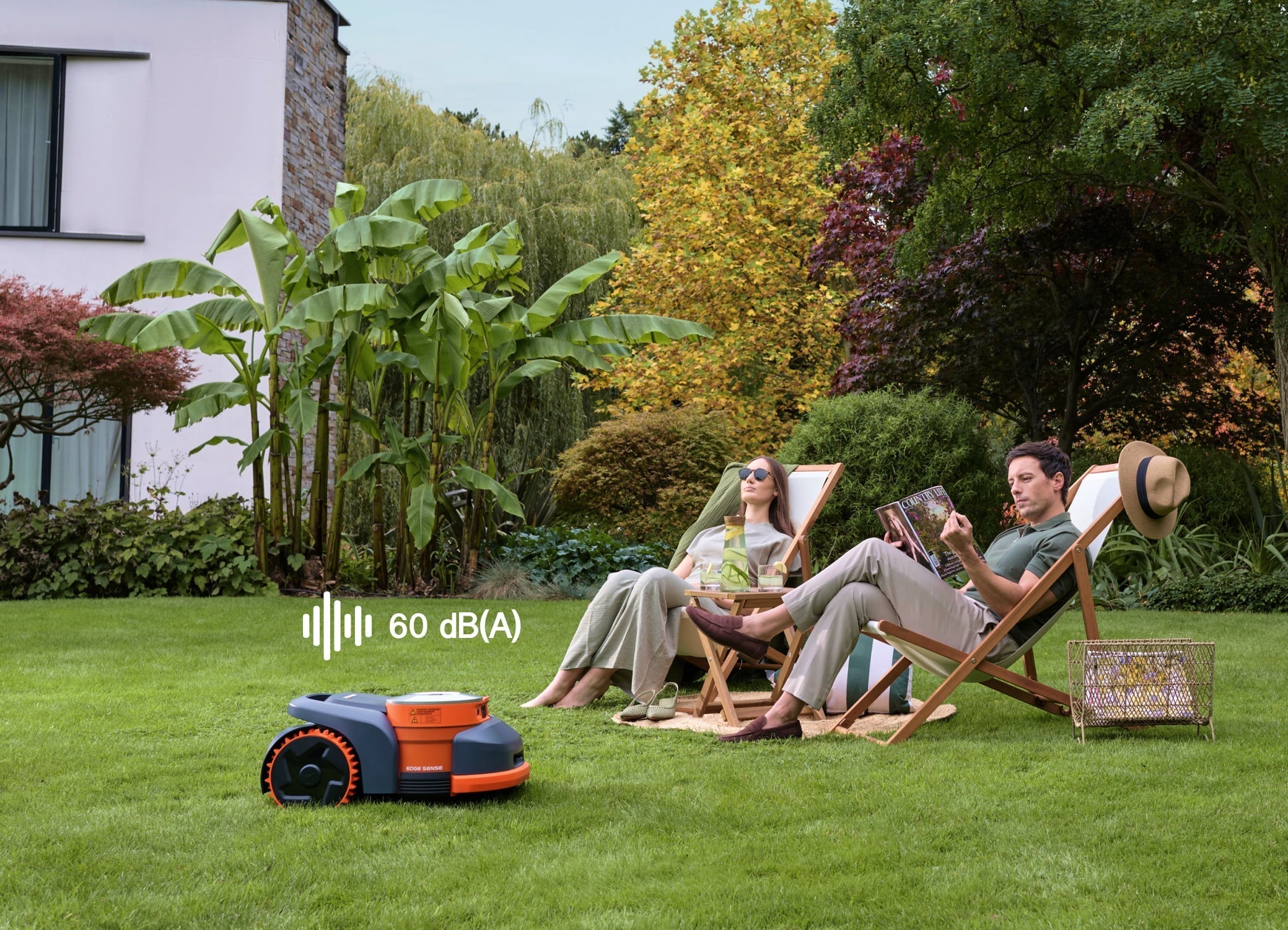 Navimow i110E robot lawn mower operates quietly in a garden.