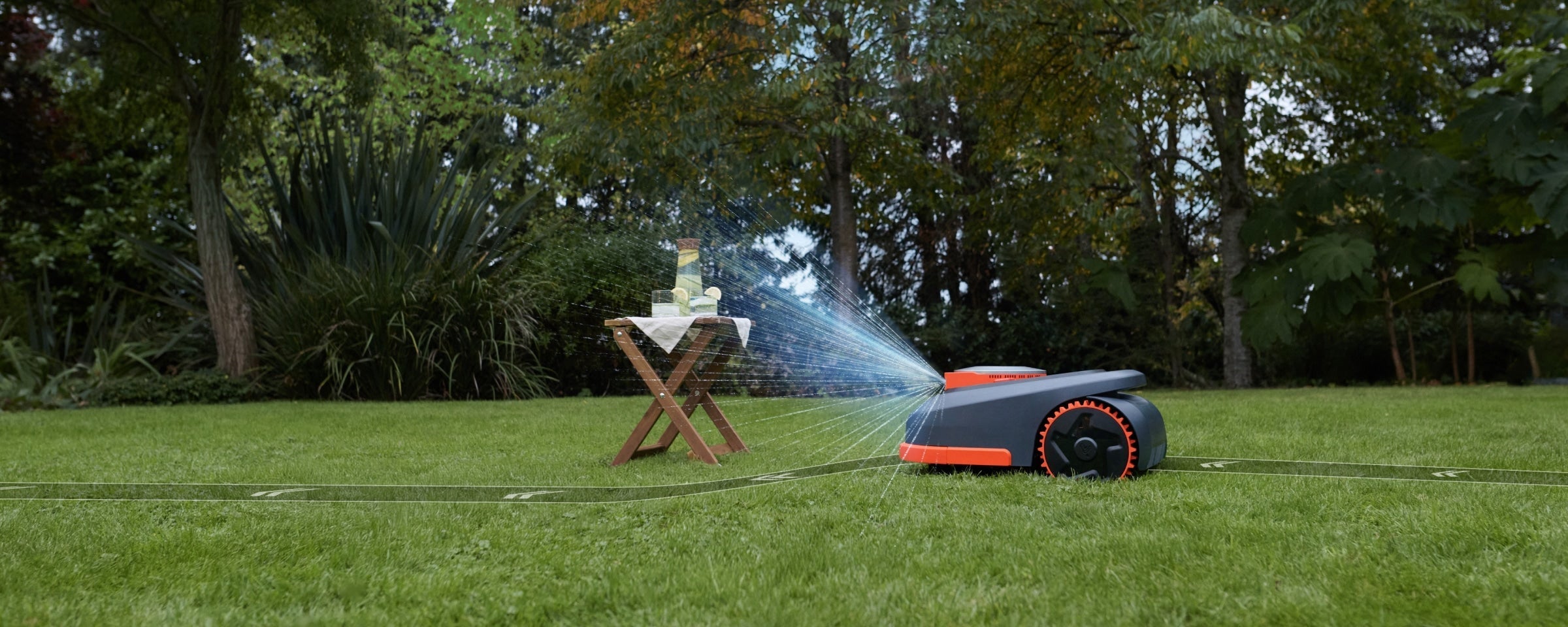 Navimow i110E robot lawn mower mows the lush green lawn.