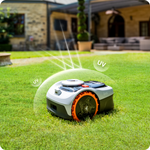 Navimow i110S robot lawn mower cutting grass in a backyard.