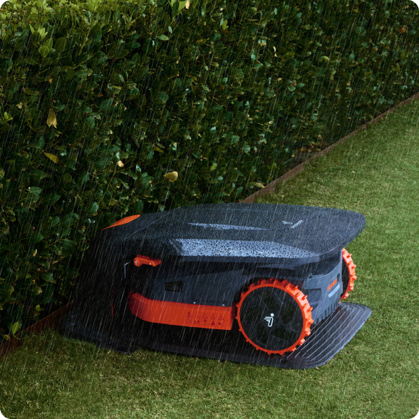 Navimow i105E robot lawn mower is parked in the rain.