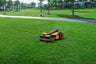 Segway Navimow i Series robot lawn mower on green grass.
