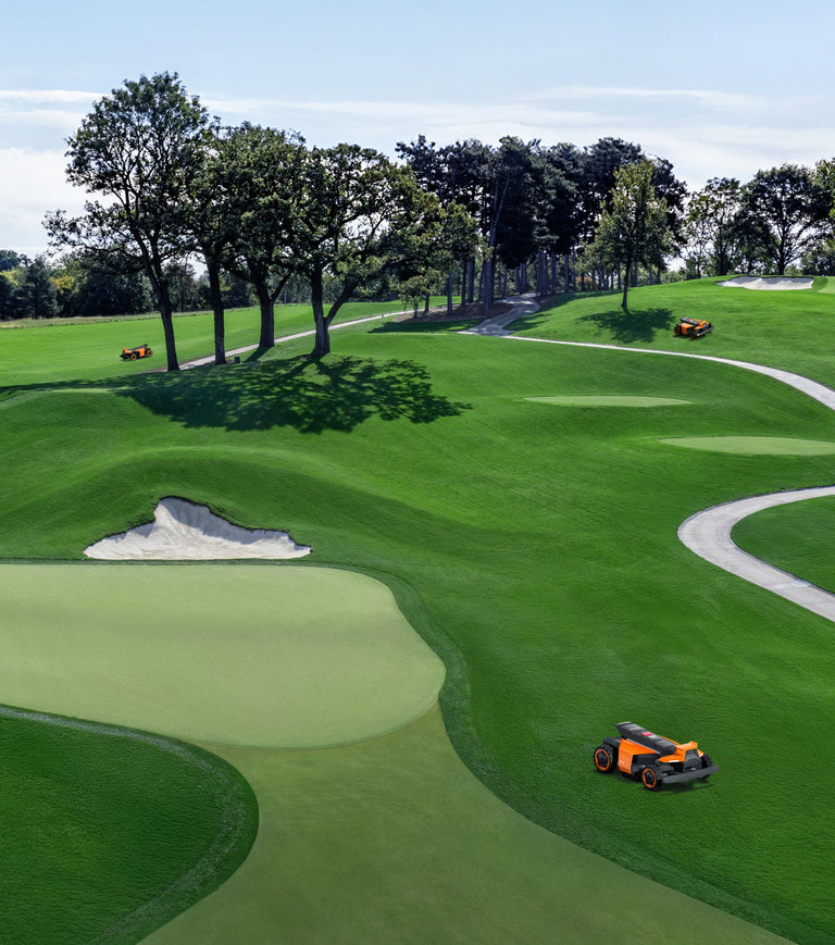 Segway Navimow i110N robot lawn mower on a golf course.