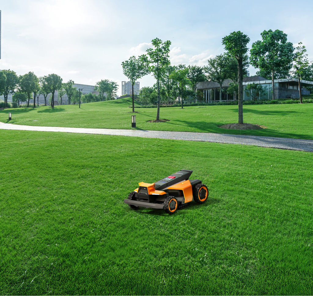 Navimow i110N robot lawn mower mows the park's green grass.