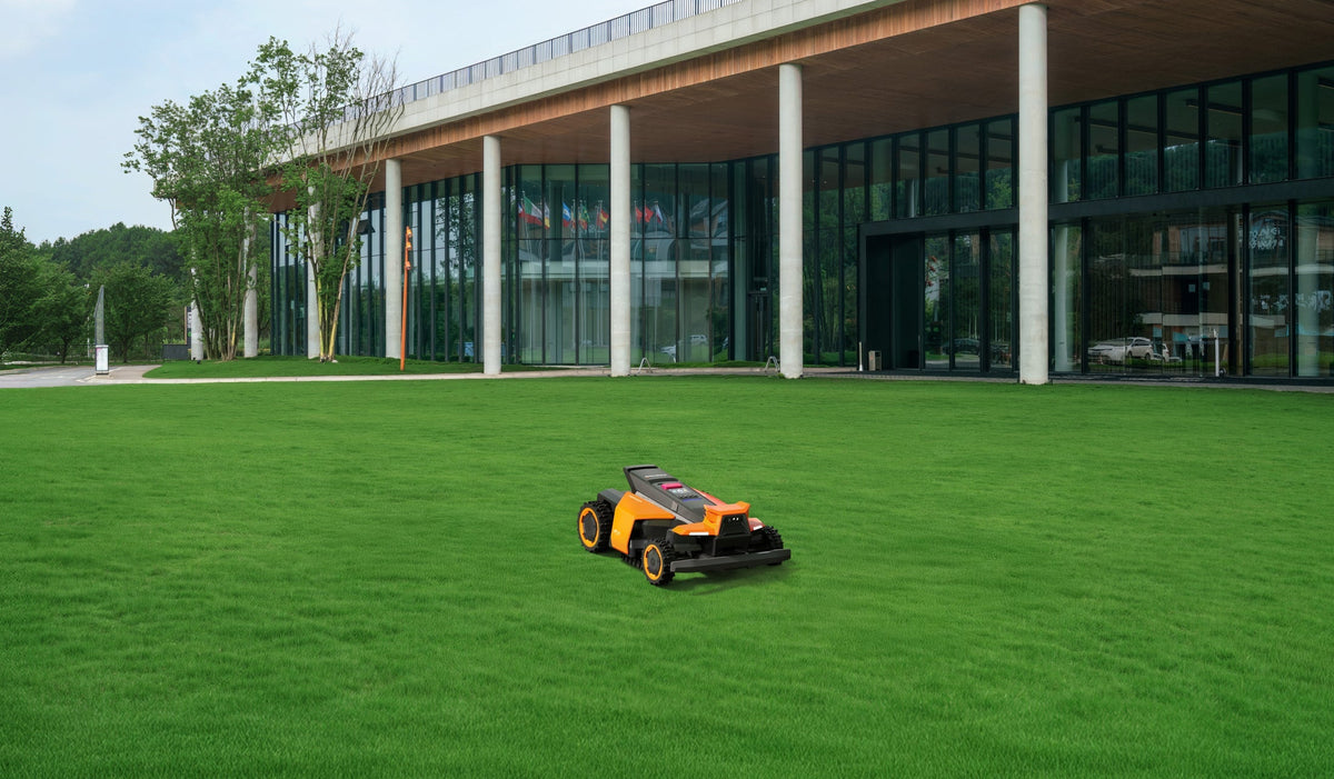 Navimow i110N robot lawn mower on the green grass field.