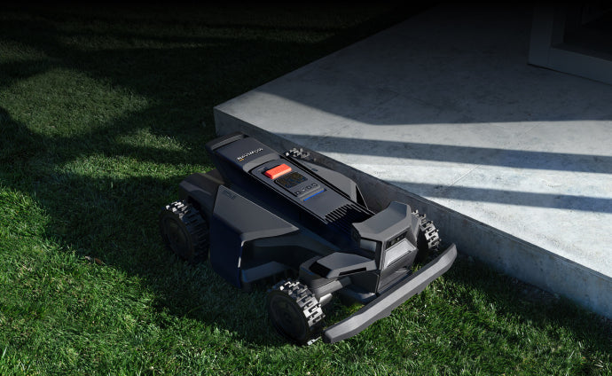 Navimow i110N robot lawn mower on the green grass lawn.