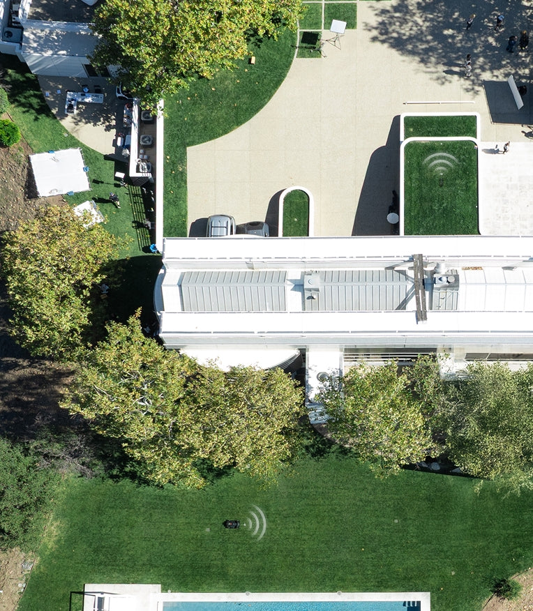 Navimow i110N robot lawn mower maintains a large green lawn.