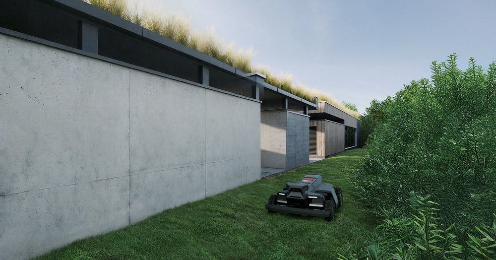 Segway Navimow i110N robot lawn mower mows grass near house.