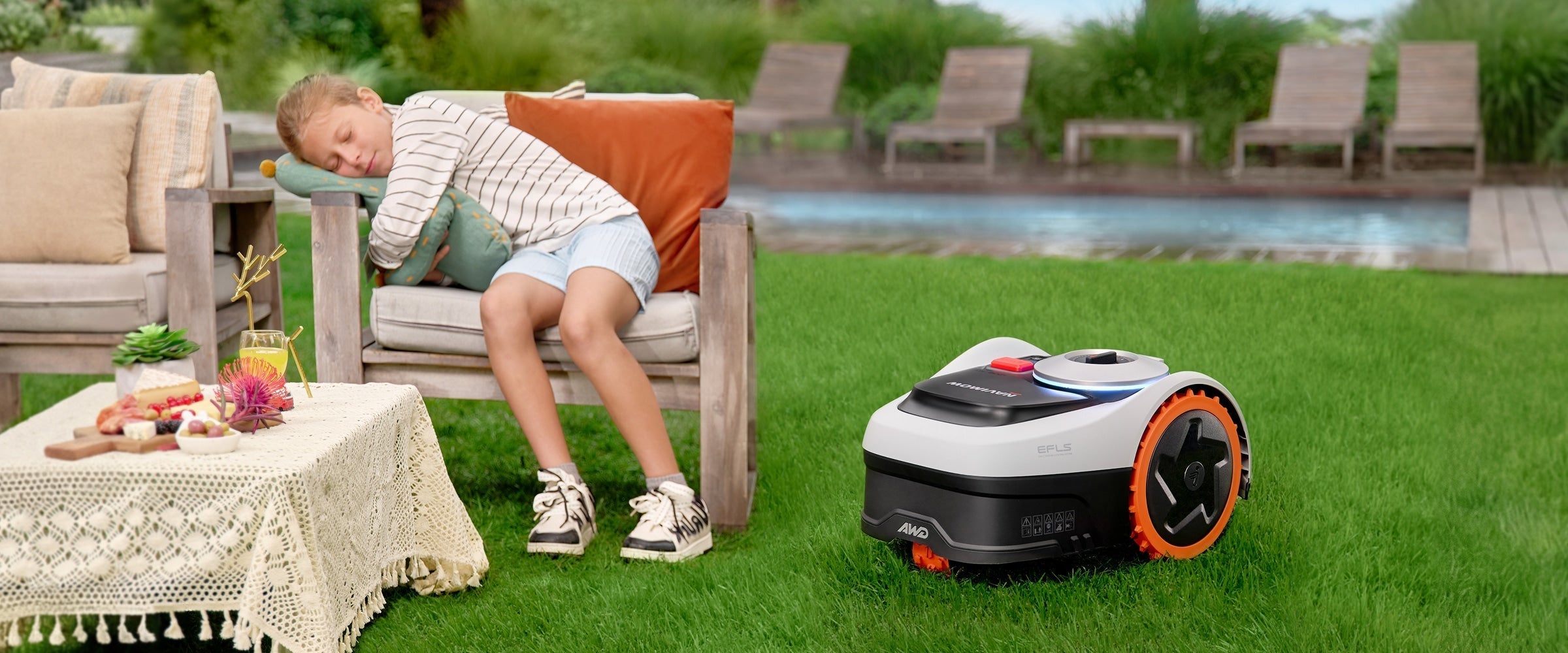 Child sleeps while the Navimow i110N robot lawn mower works.