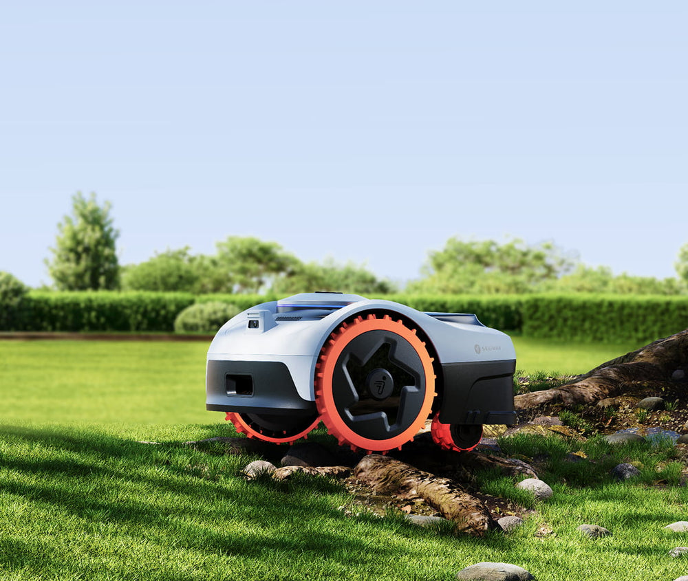 Segway Navimow i Series robot lawn mower on green grass.