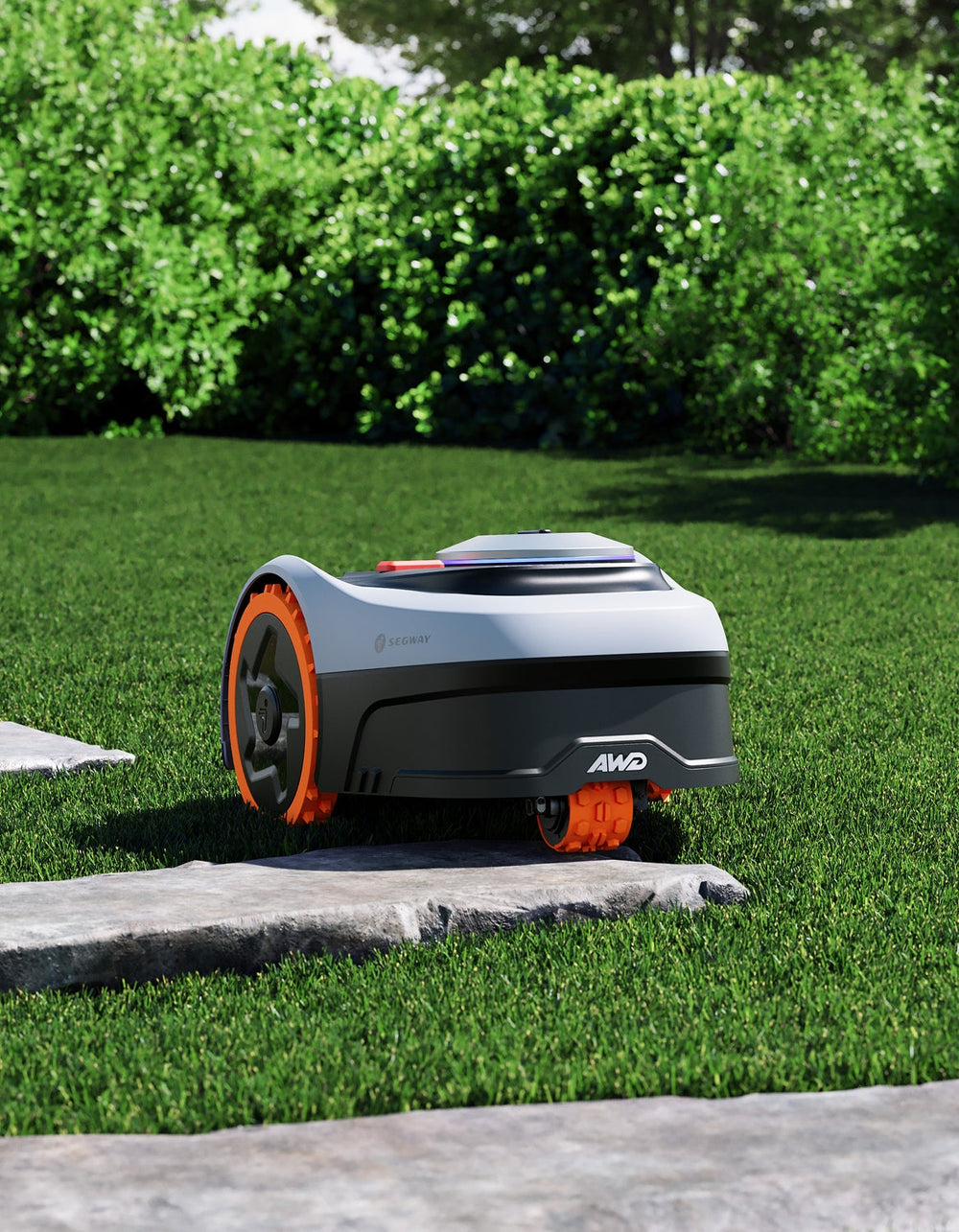 The Segway Navimow AWD robot lawn mower sits on grass.