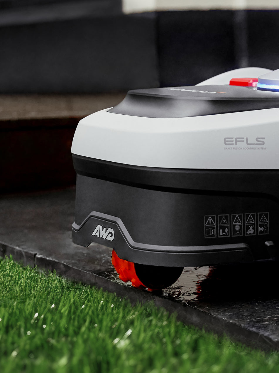 Segway Navimow H series robot lawn mower on wet grass.