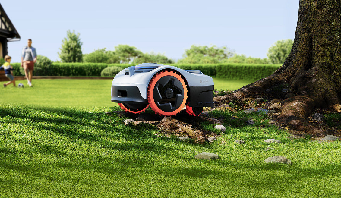 Segway Navimow i110N robot lawn mower mows the green lawn.