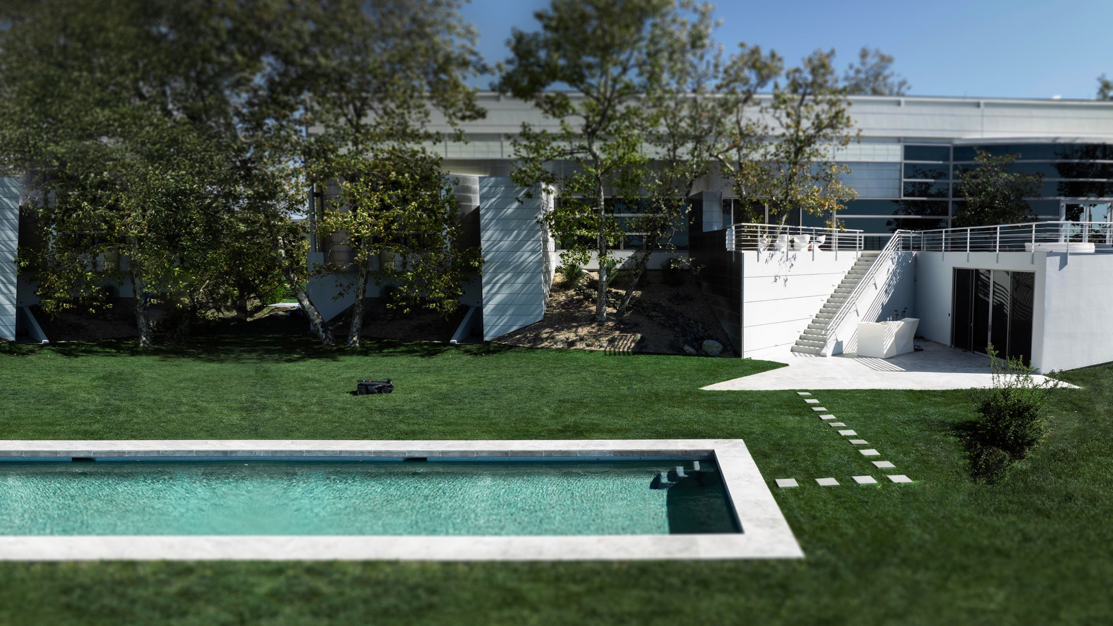 Navimow i110N robot lawn mower works on the garden lawn.